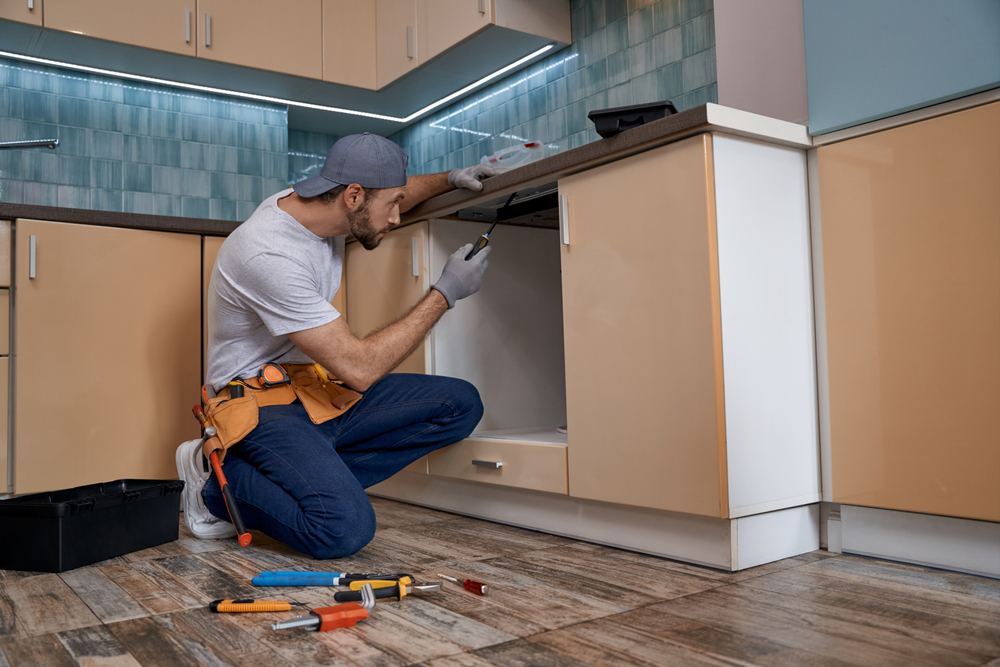 young,caucasian,repairman,screwing,new,kitchen,furniture