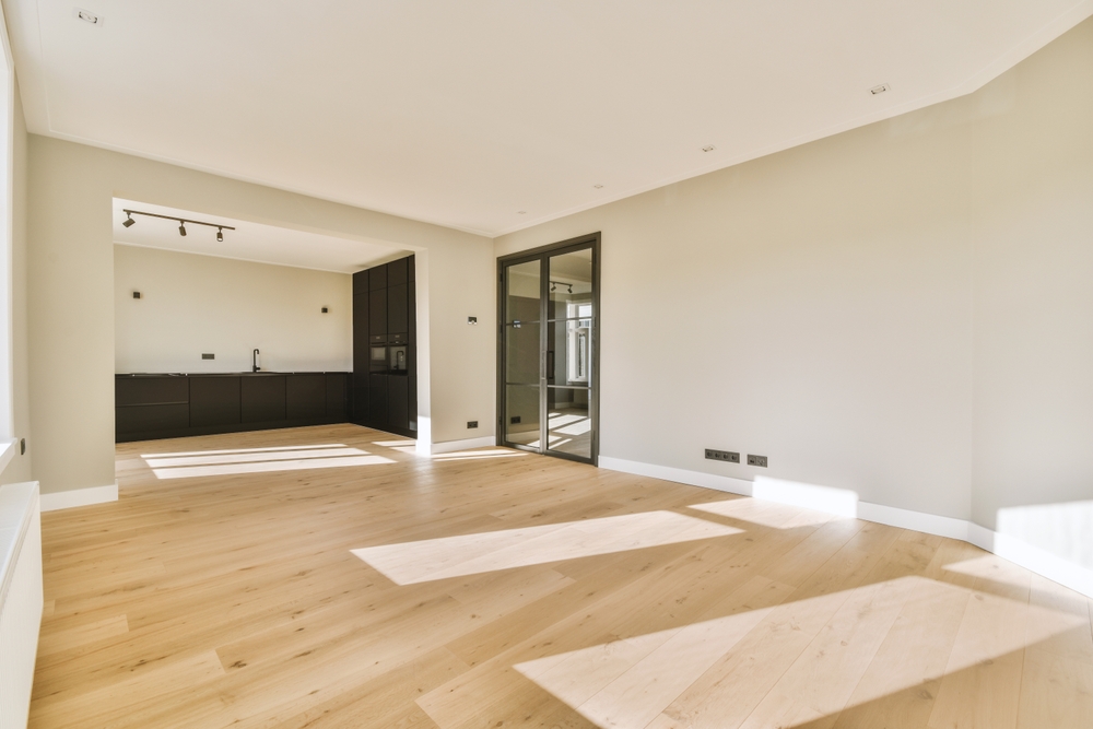 interior,of,empty,white,kitchen,with,windows,and,wooden,parquet